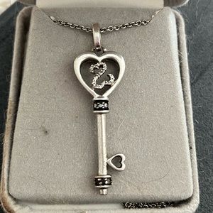Black and white diamond key necklace
